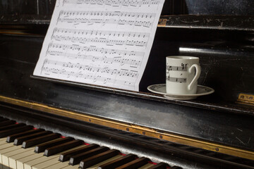 The white coffee cup put on vintage piano key - 760584998