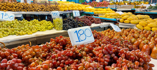 banner of fresh ripe grapes lying on a market showcase