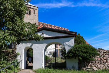 Naklejka premium Historic entrance gate to the old church, Poland, Europe, Lubusz Voivodeship, Solniki