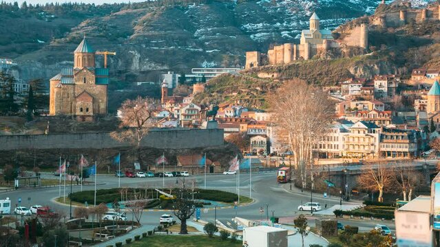 Tbilisi, Georgia. Metekhi Church And The Equestrian Statue Of King Vakhtang Gorgasali In Tbilisi, Georgia. early spring season. timelapse time lapse Scenic View Of Impregnable Fortress Narikala