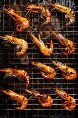 Top view of grilled shrimps on grilling rack for food background with copy space for text. Generative AI.