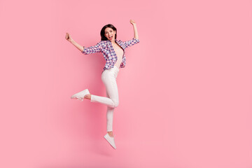 Full length side profile body size photo funny beautiful her she lady jump high holiday fists raised wear shoes casual checkered plaid shirt white jeans denim clothes outfit isolated pink background - obrazy, fototapety, plakaty