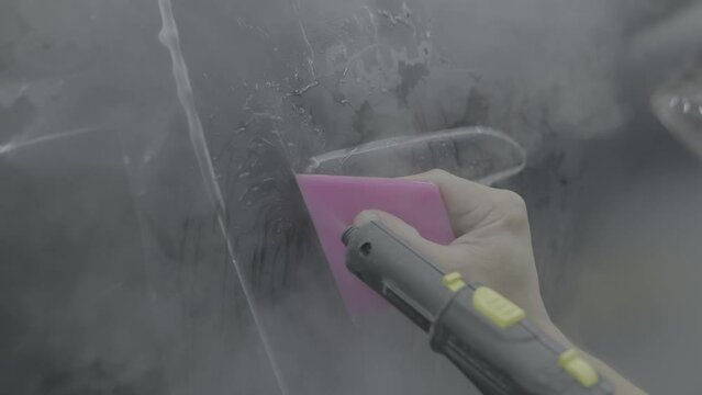 Gluing the ppf film on the car with the steam