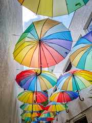 Many multi colored umbrellas decoration - 760621717