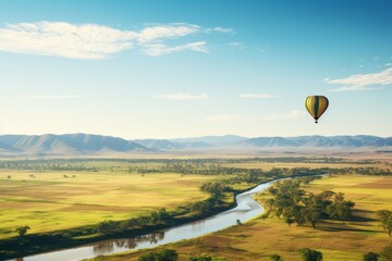 Hot air balloon over lush green fields with clear sky, perfect for text insertion
