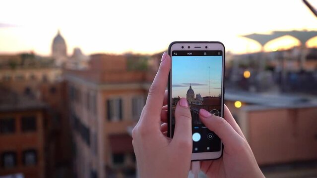 Woman Making A Photo Of The City On Smartphone During Her Travel In Rome, Italy