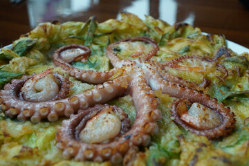 Korean-style pancakes with whole octopus and green onion