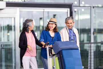 Group of Asian family tourist passenger with senior is leaving airport terminal for transportation during their vacation travel and long weekend holiday