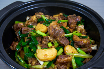 A pot of delicious braised duck with water chestnuts, home cooking