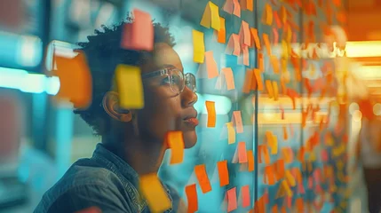 Foto op Canvas A creative brainstorming session for career rethinking with post-it notes on a glass wall © Татьяна Креминская