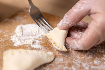 Pies are made from puff pastry and meat. Preparation of meat pies from puff pastry.