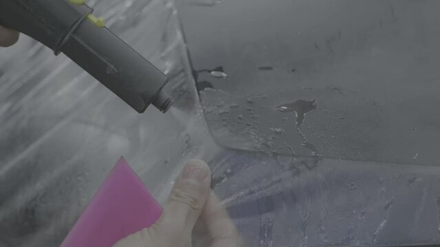 Gluing the ppf film on the car with the steam