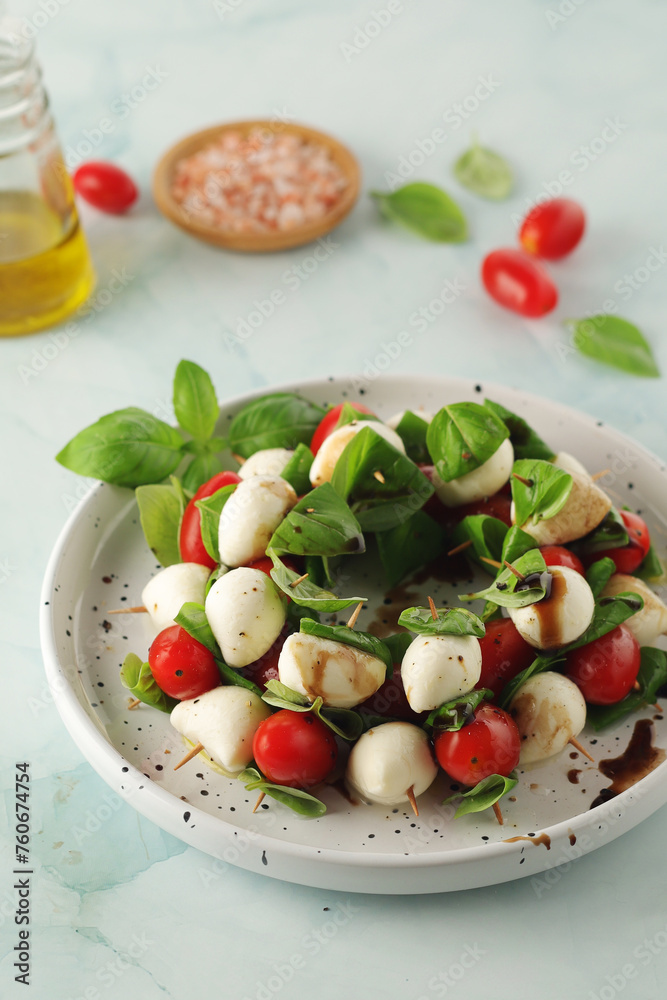 Wall mural a plate with italian salad caprese canape