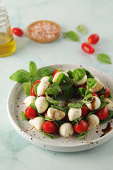 A plate with Italian salad caprese canape