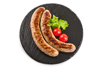 Grilled Bavarian pork sausages, isolated on white background.
