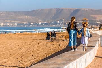 people walking on beach