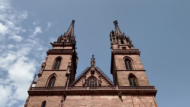 Basel Minster Cathedral Exterior Views. Basler M&uuml;nster (Basel Minster) Cathedral in Basel, Switzerland. Beautiful exterior views of the twin peaks in this most popular landmark in the city. 