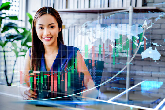 Double exposure of stock market graph and business woman working on laptop computer at office. financial stock exchange marketing concept.