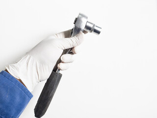 Man's hand with gloves holds a Ratchet Wrench  isolated on white background, Mechanical tools wrench concept.