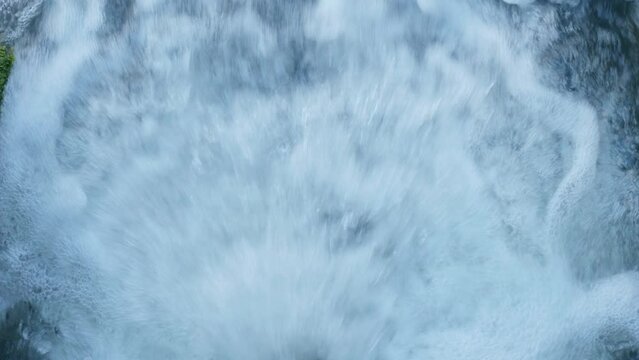 Detail shot of a strong turbulence and flow of water from a pipe