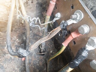 Burnt ground cable, failure in the industrial electrical installation grounding system. Failure earth system concept.