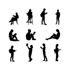 silhouettes of people reading a book