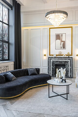 bright luxurious expansive interior of country chalet with stunning views of winter forest through panoramic windows white walls with ornaments, fireplace, work and sitting area without people daytime