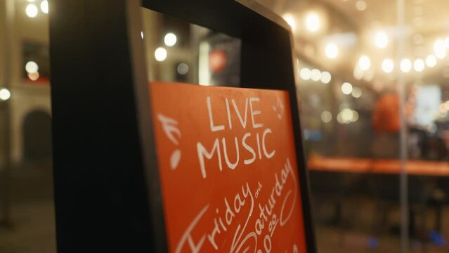 Handwritten sign Live music Enjoy live tunes here