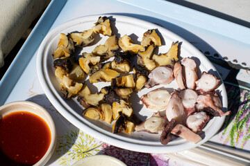 Boiled octopus and conch on a plate