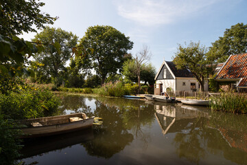 Fototapeta na wymiar River - Het Gein, flows through the rural landscape near the rural village of Abcoude.