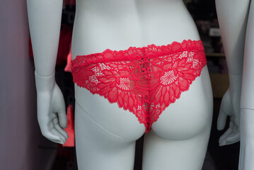 Closeup of red cheeky on mannequin in a fashion store showroom - 760725559