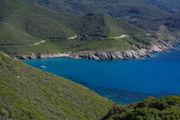 Fototapeta premium Corsica, seascape in the cap Corse, a creek with a boat 