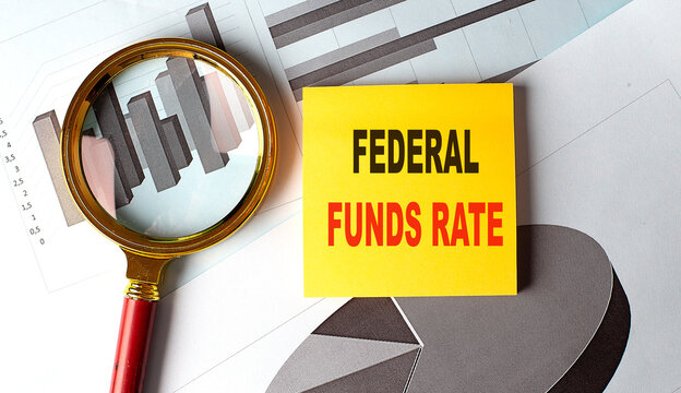 FEDERAL FUNDS RATE text on sticky on chart background