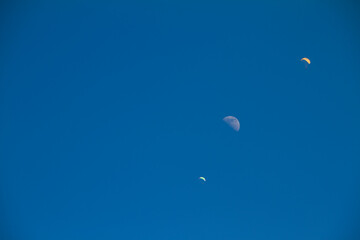 two parachutes and a half moon