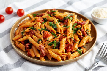 Homemade One-Pot Creamy Tuscan Pasta on a Plate, side view.