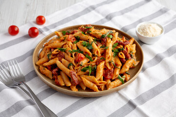 Homemade One-Pot Creamy Tuscan Pasta on a Plate, side view.