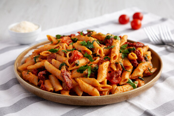 Homemade One-Pot Creamy Tuscan Pasta on a Plate, side view.