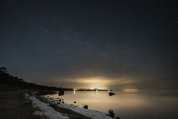 Landscape astrophoto on the shore of the Baltic Sea in Kaberneeme on the beach.