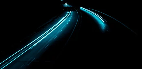 Afwasbaar Fotobehang Snelweg bij nacht blue car lights at night. long exposure