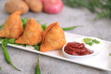 Samosa Indian famous street food snack closeup with selective focus and blur