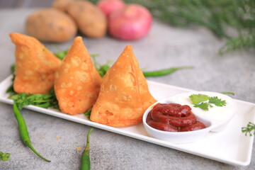 Samosa Indian famous street food snack closeup with selective focus and blur