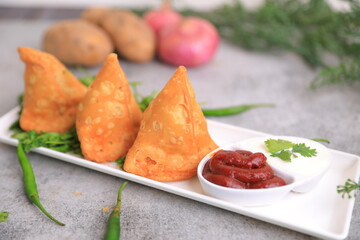 Samosa Indian famous street food snack closeup with selective focus and blur