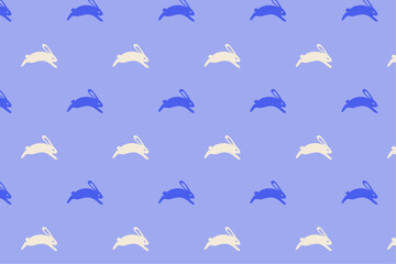 Seamless pattern with white and blue rabbits on violet background. Easter and spring theme design for textile, wallpaper, and wrapping paper