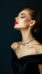 Elegant woman in black dress and necklace studio shot with copy space for text placement