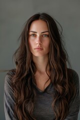 Fototapeta premium Woman With Long Brown Hair in Gray Shirt