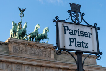 Iconic Pariser Platz Sign with Brandenburg Gate Quadriga in Background