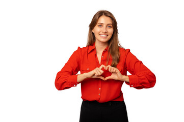 Fototapeta premium Studio shot of a young woman wearing red shirt holding heart gesture over her chest.