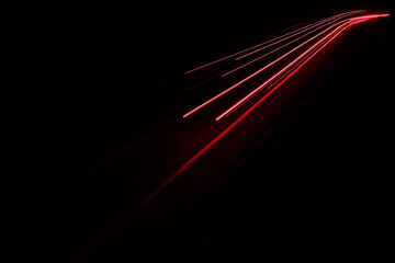 lights of cars driving at night. long exposure