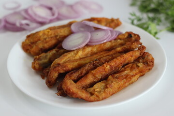 Golden crispy Bombil fish fry, delectable seafood dish popular in Mumbai coastal cuisine