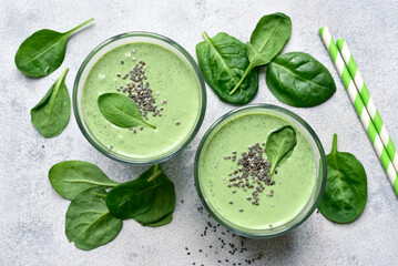 Detox spinach smoothie in a tall glass. Top view with copy space.